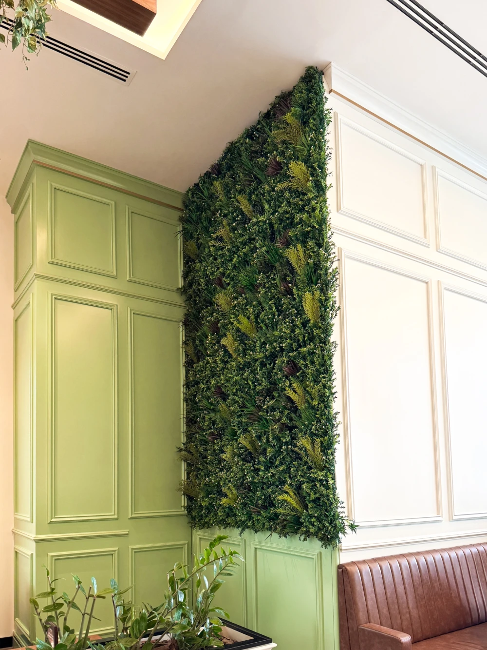 artificial green wall installed in a cafe